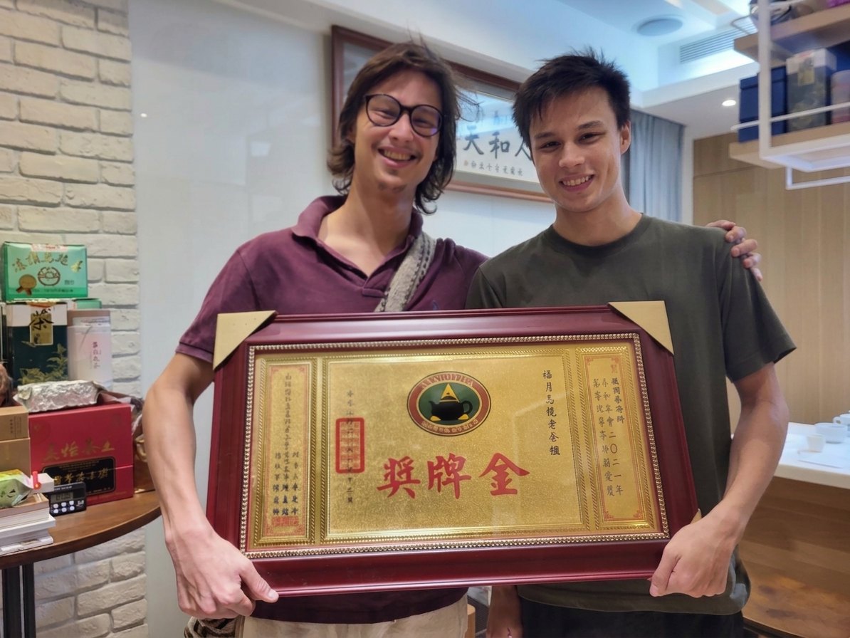 Receiving a gold-medal plaque at a Taiwanese tea competition