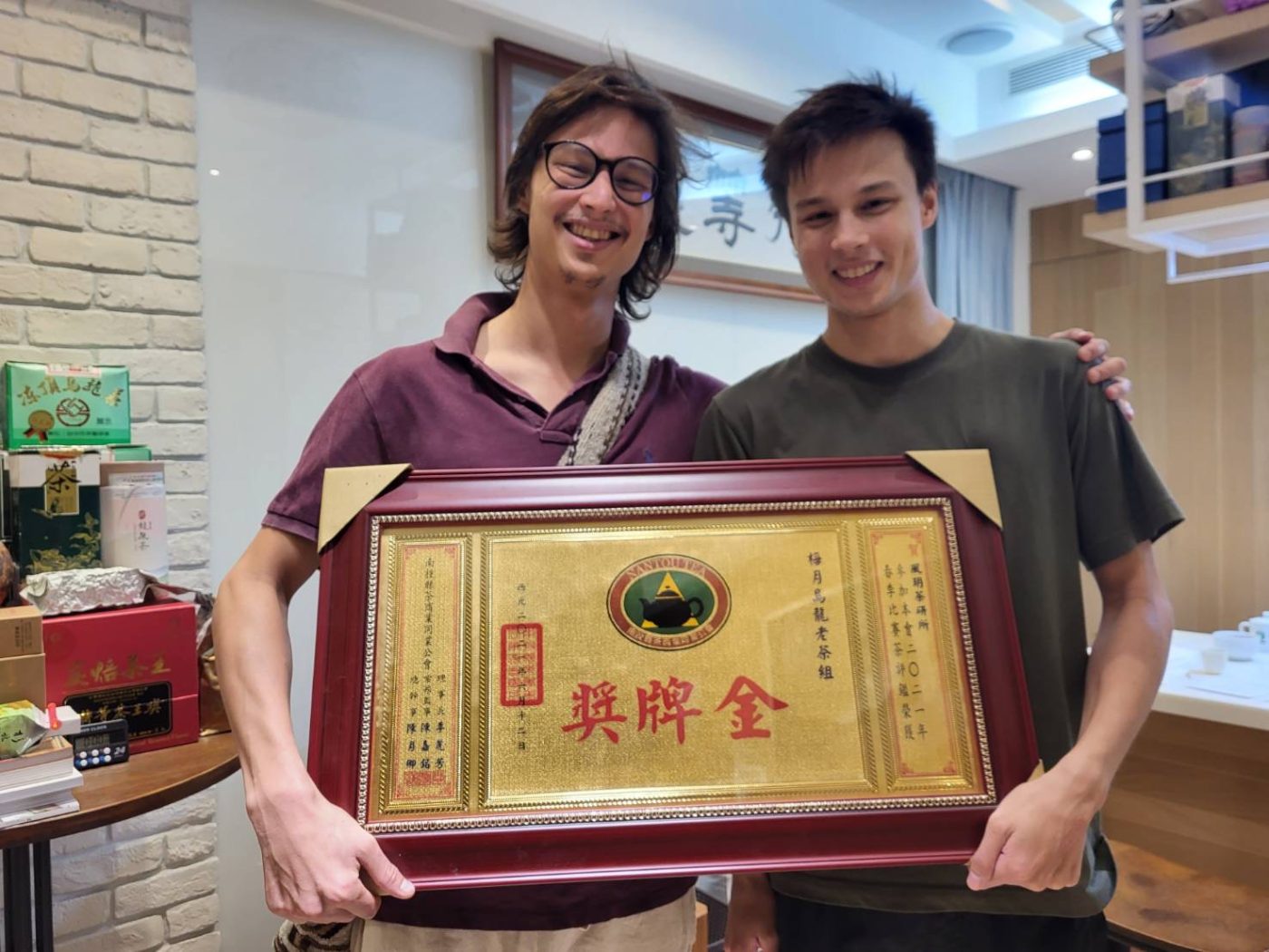 Receiving a gold-medal plaque at a Taiwanese tea competition