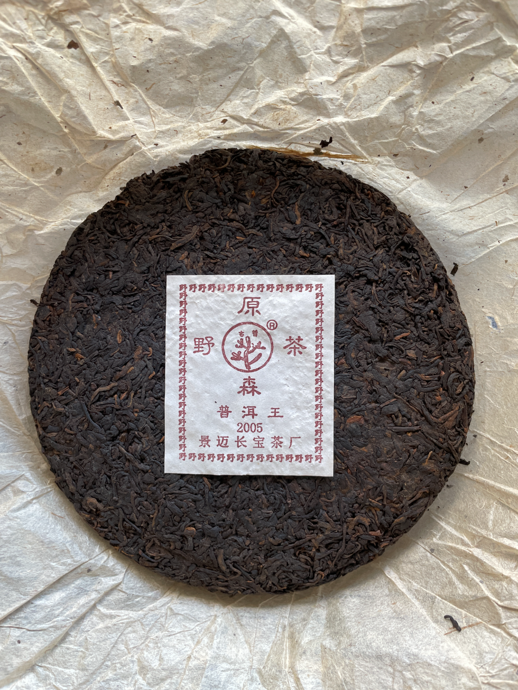 The cake unwrapped, showing the JingMai Changbao factory label